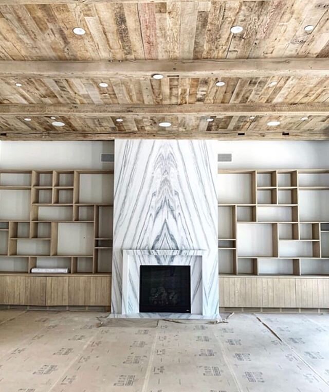 Brentwood progress shot: Reclaimed wood ceilings, white oak artistic shelving layout, and a bold marble fireplace 🔥 #tiffanyharrisdesign