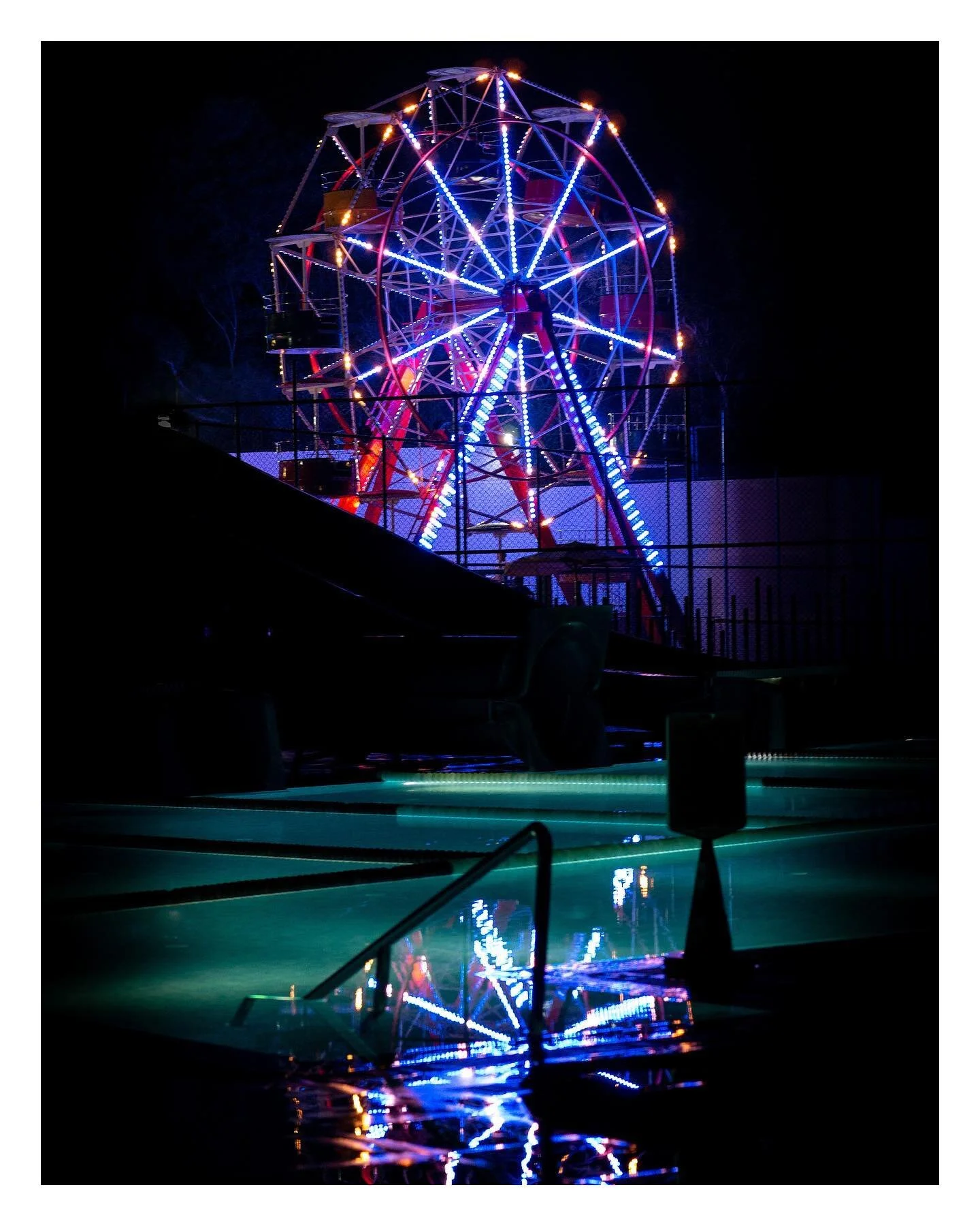 Fun Fair Reflection - looking back on some old holiday photos, this one from Turkey. Love the reflection in this one on the blue / green lit pool. @voyagehotels

#amateurphotography #amateurphotographer #amateurphoto #amateurphotos #photography #rawp