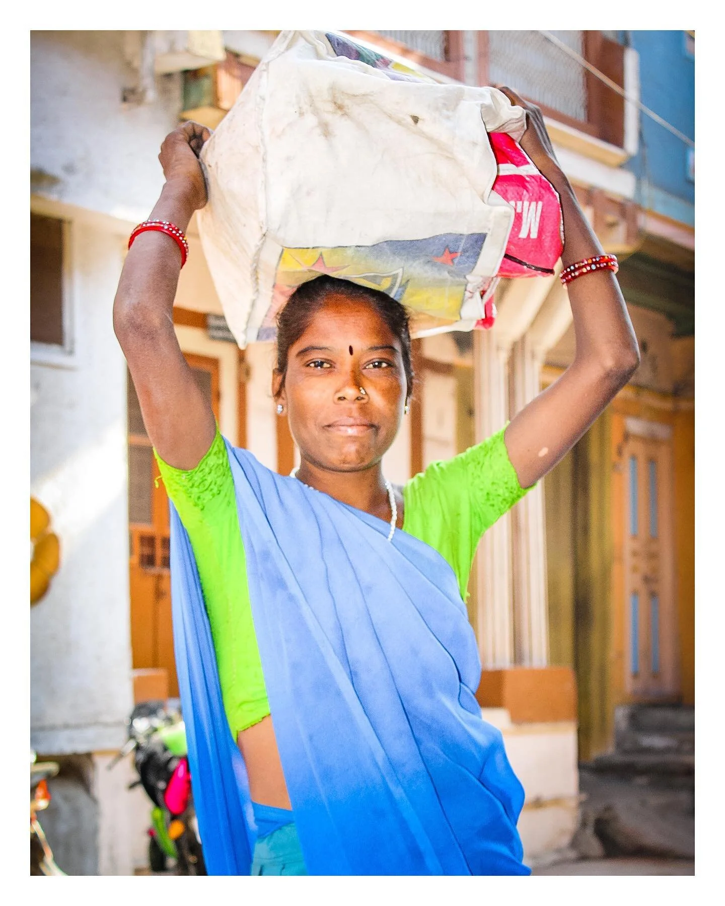 Nadiad Portrait - Taken a long time ago on my first ever DSLR. This lady stopped me and asked me to take her photo, even though I had no way of sharing it with her. 

It amazed me when in rural India people would stop you so that you take their photo