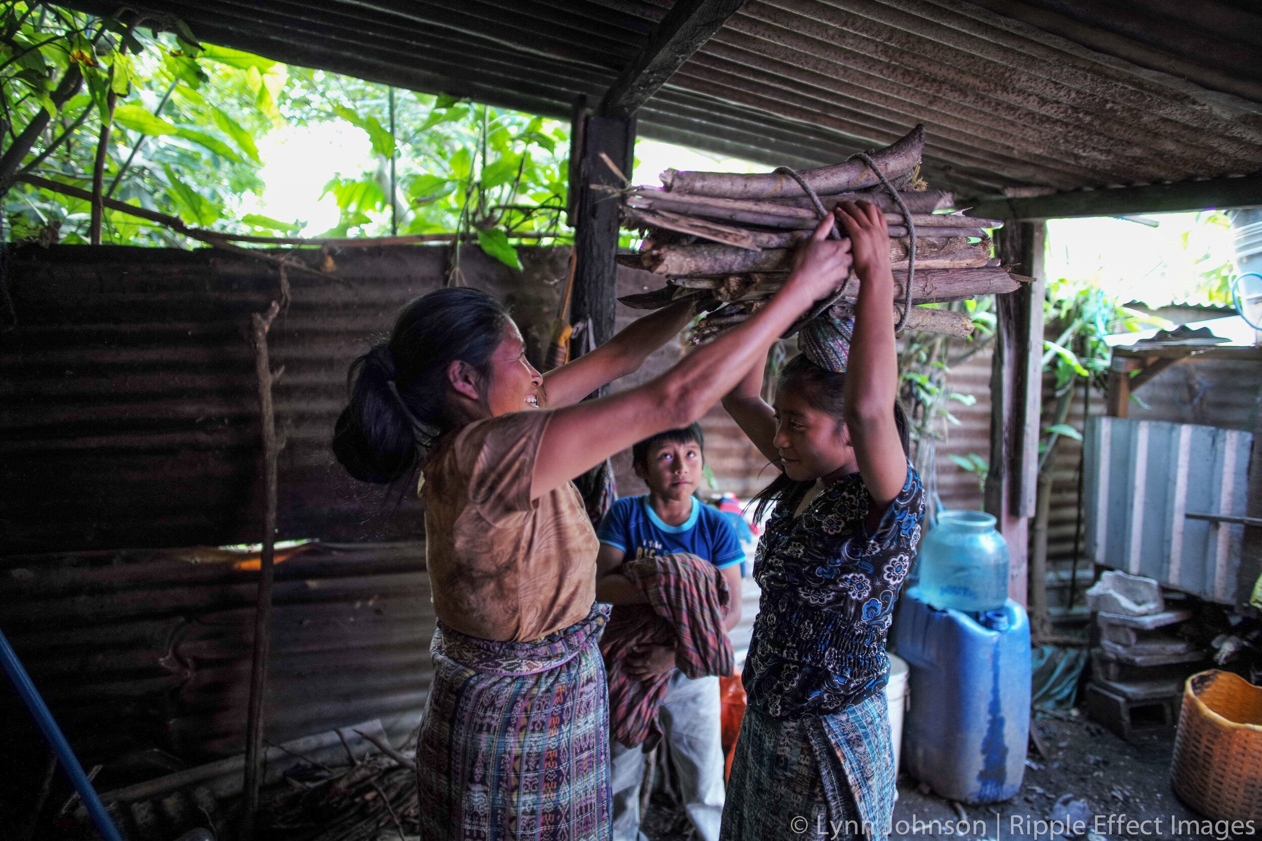 Girl Carrying Wood.jpg