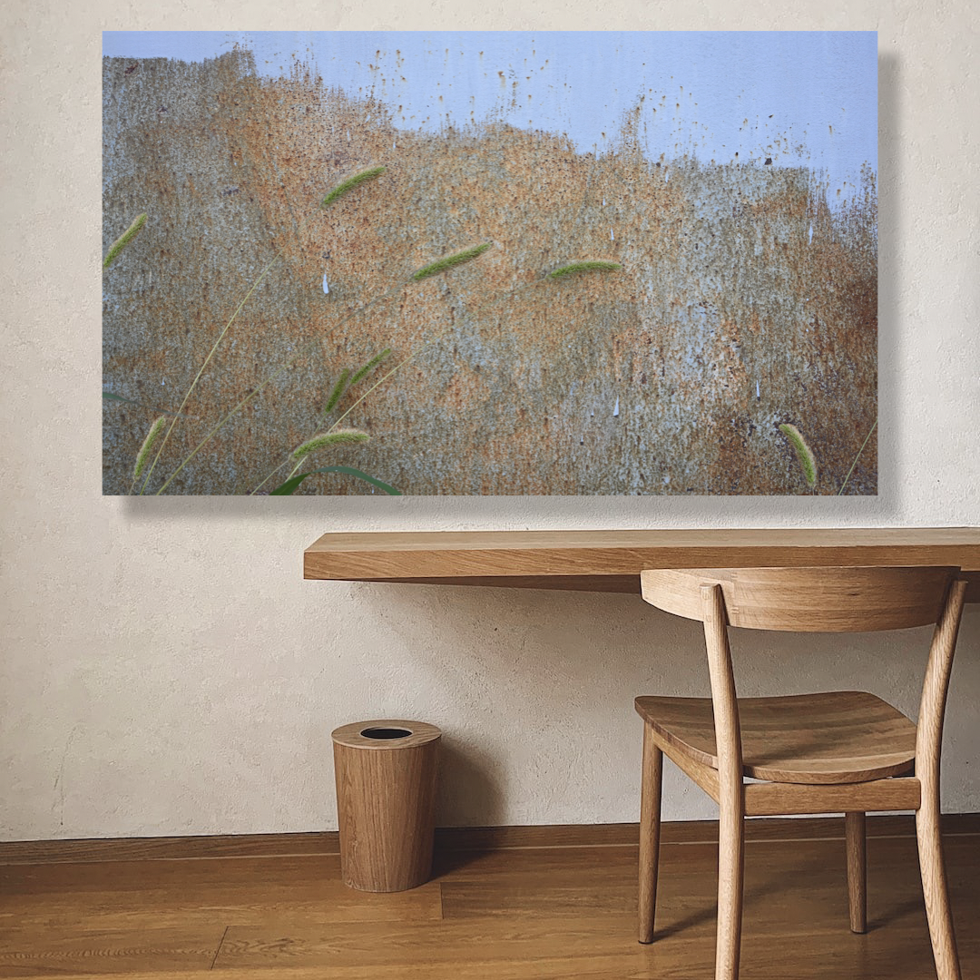 landscape abstract print hanging in a modern minimalist living room