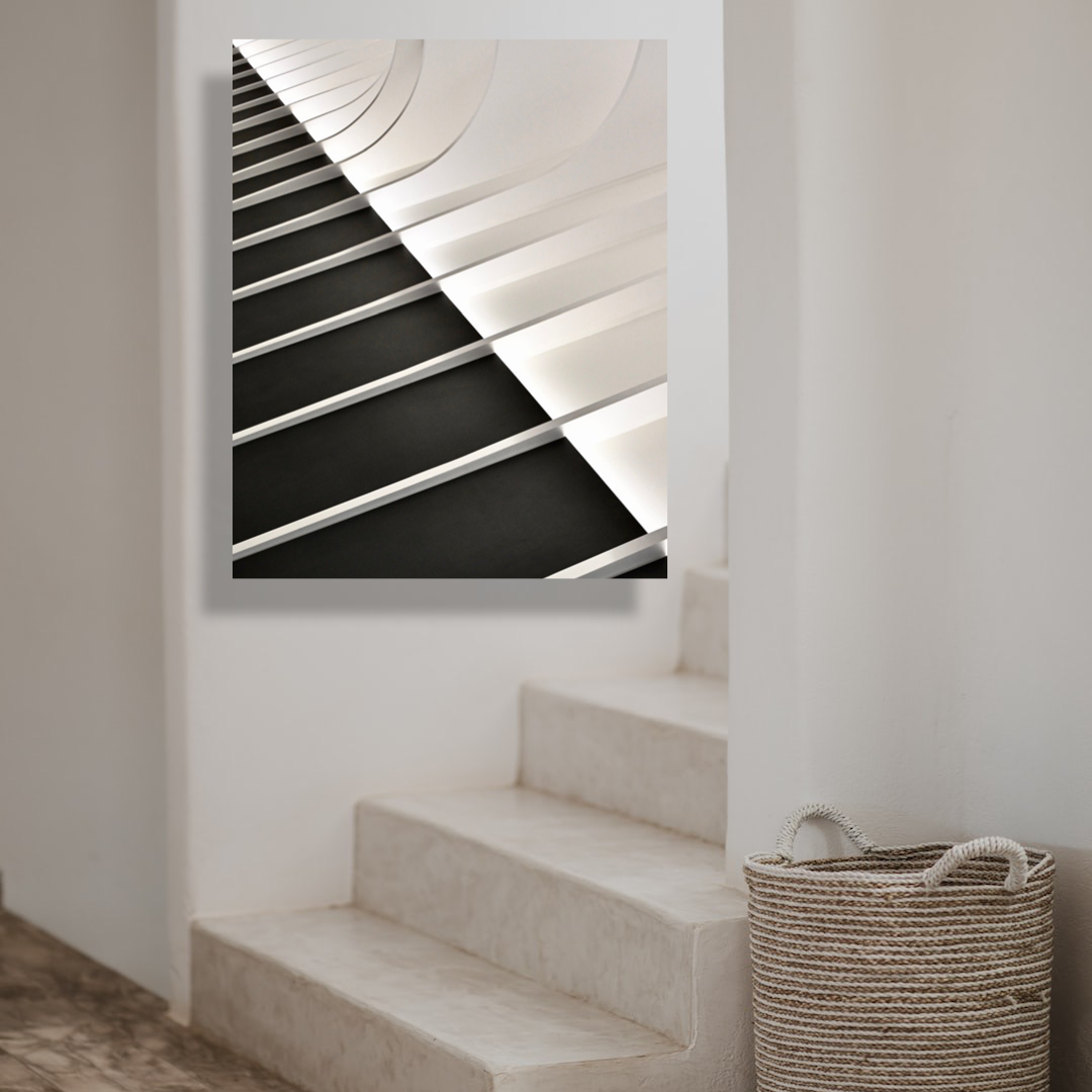 black and white print of arch in minimalist interior