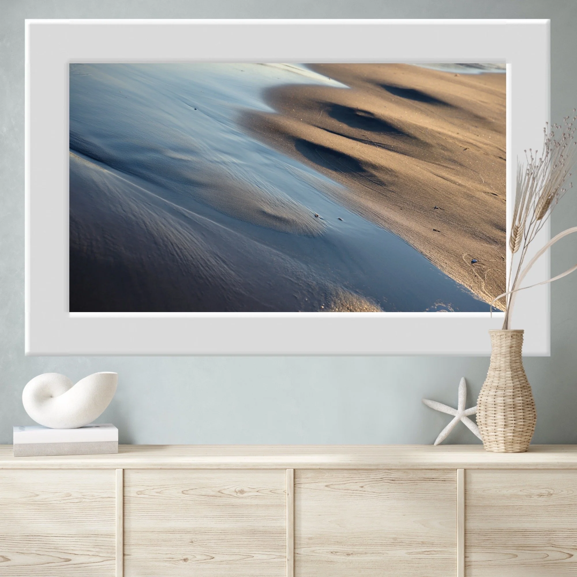 minimalist interior featuring a sea shore fine art print