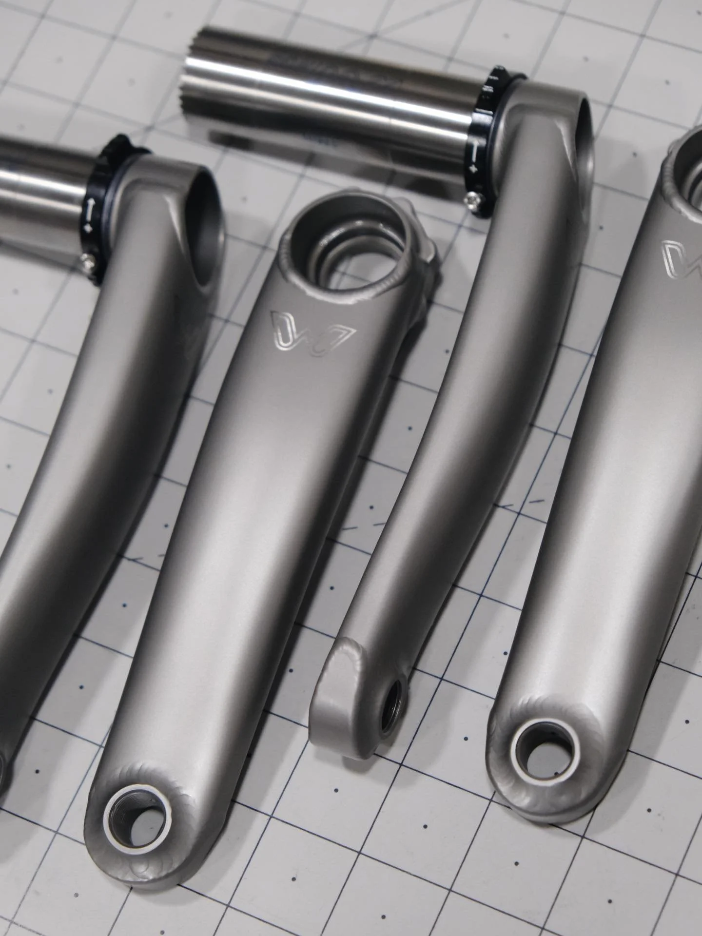 Stone cold beauties. These 8-bolt eeWings got a squeaky clean refinish in satin grey, with brushed silver logos. This satin grey finish is intended to match up well with the bead-blasted satin finishes from many framebuilders. For when a match is a m