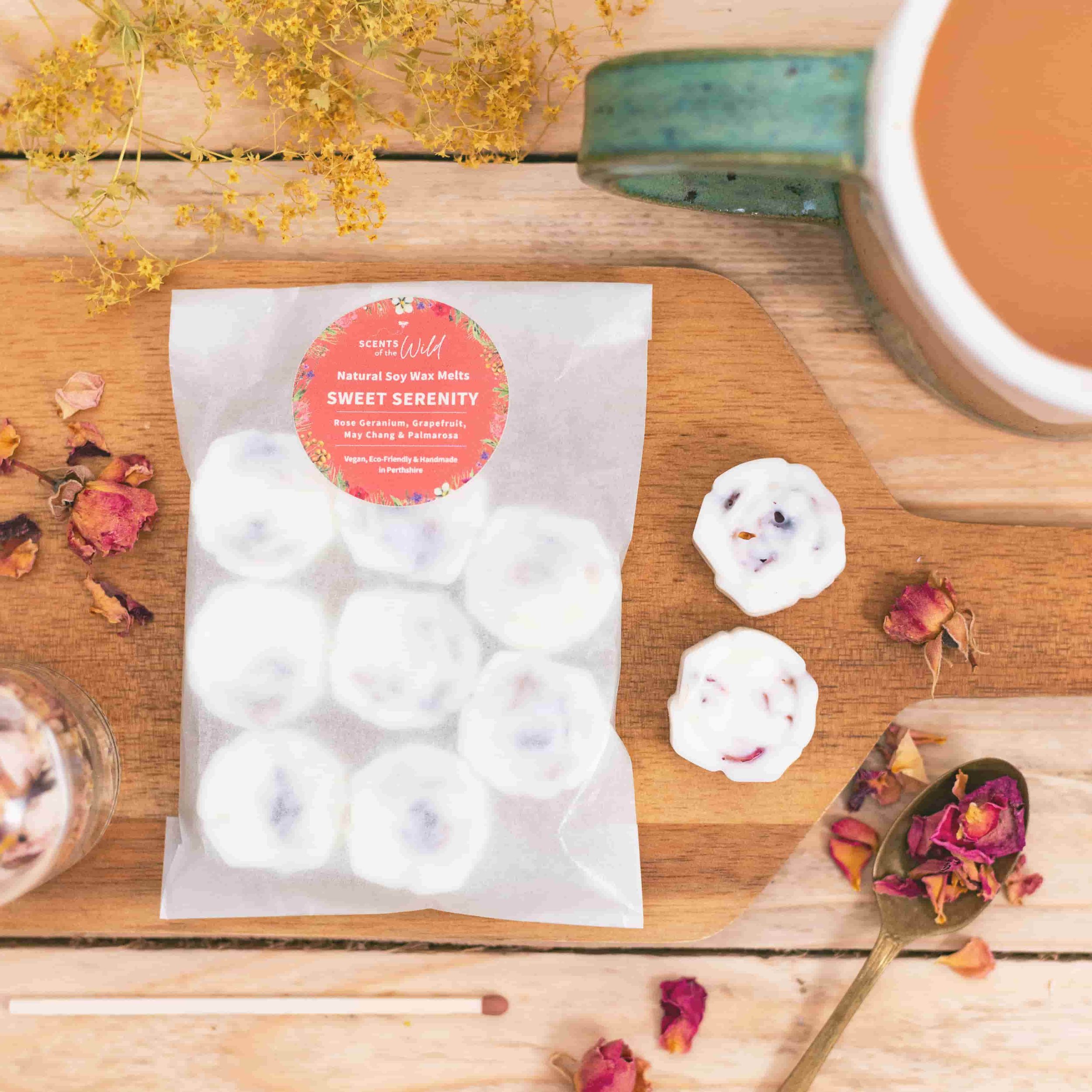Flat lay packet of Sweet Serenity botanical soy wax melts and mug of tea.jpg