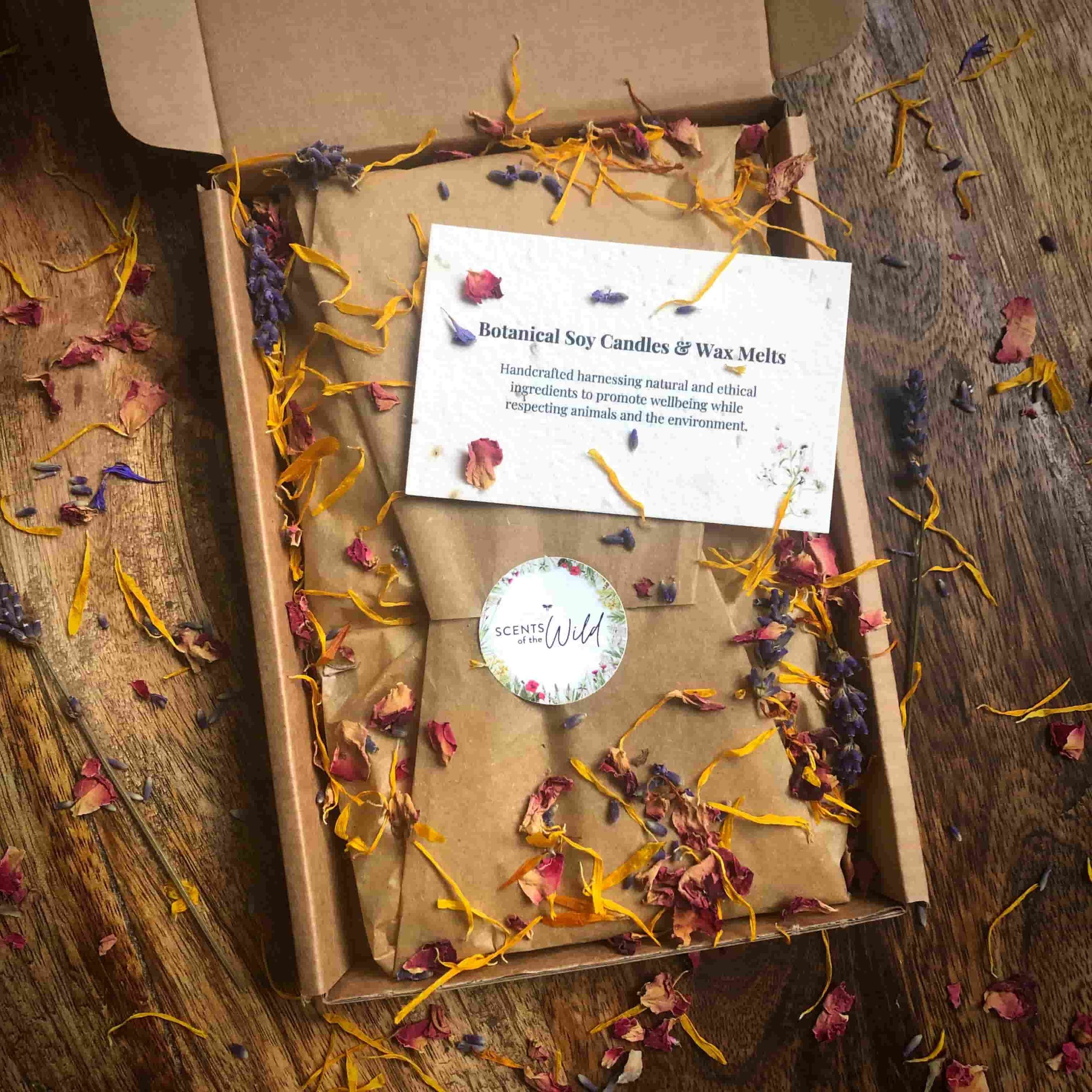 Eco wrapped soy wax melt gift set box scattered with colourful dried botanicals.jpg