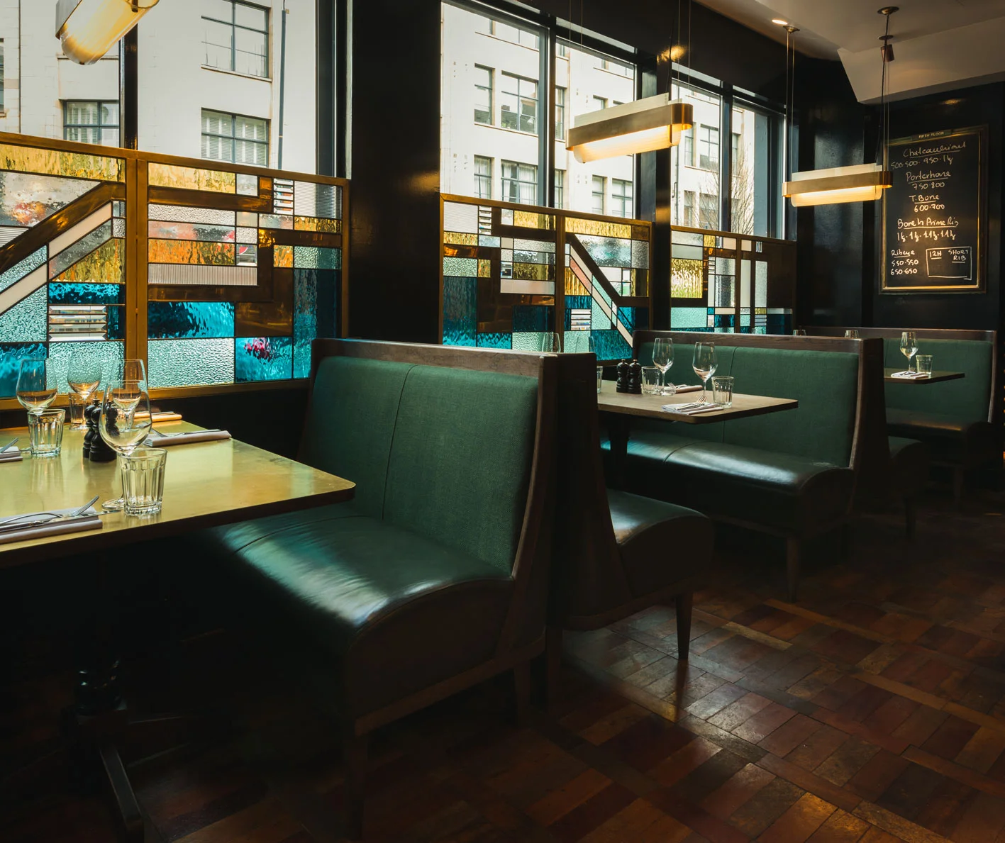 Hawksmoor Art Deco stained glass screens. Leather upholstered booths.