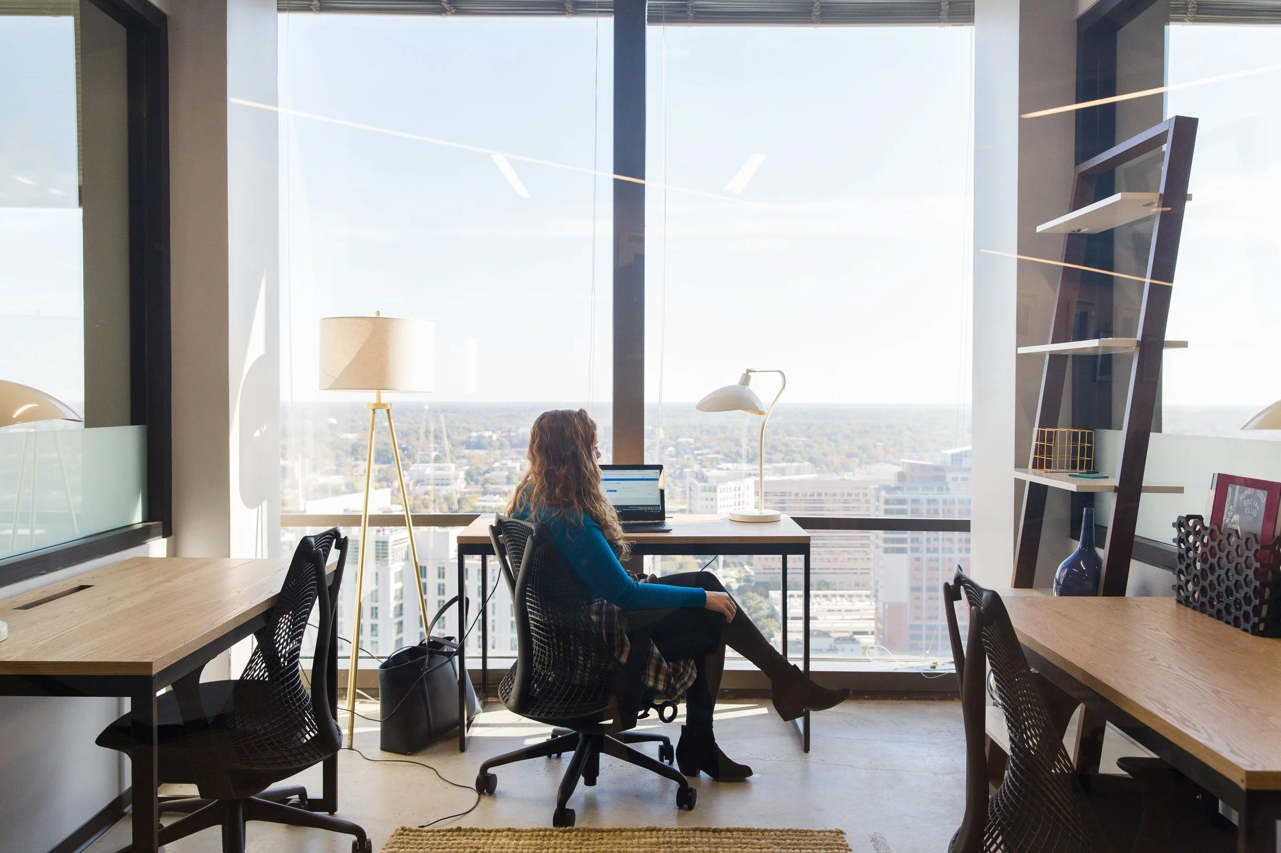 Professional working on a laptop in a high-rise office