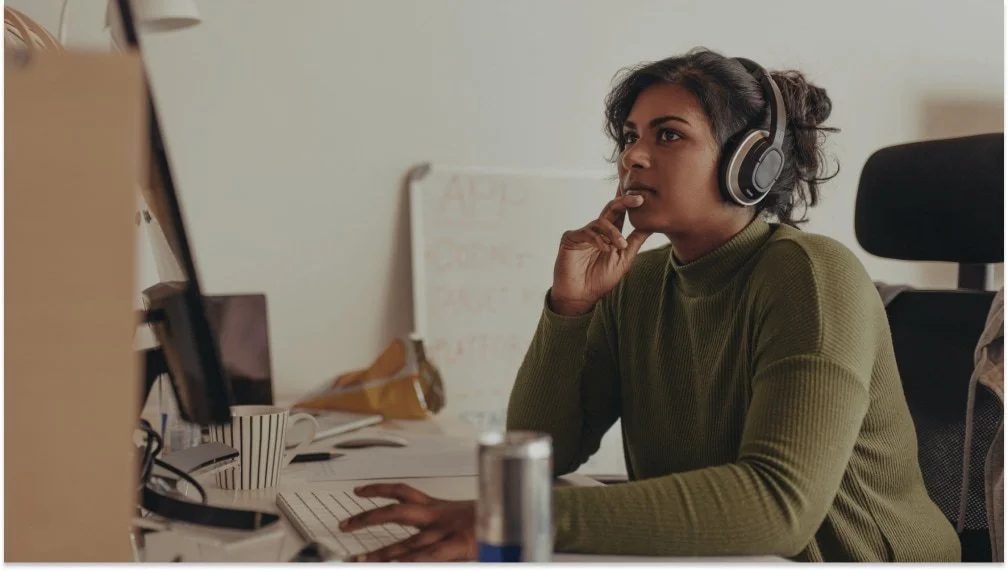 Business owner using AI tools at a workstation