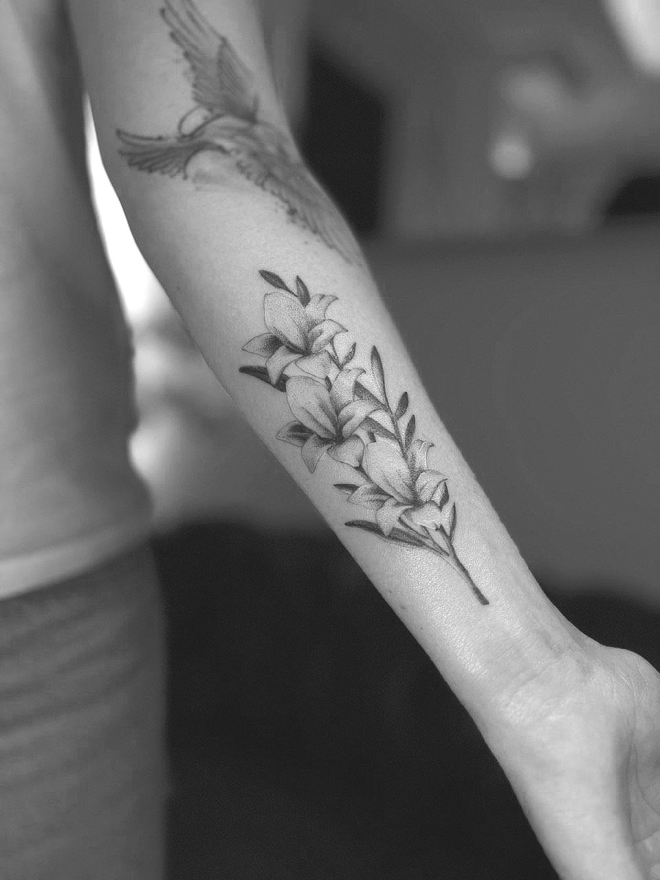 Fine line flower tattoo by Math