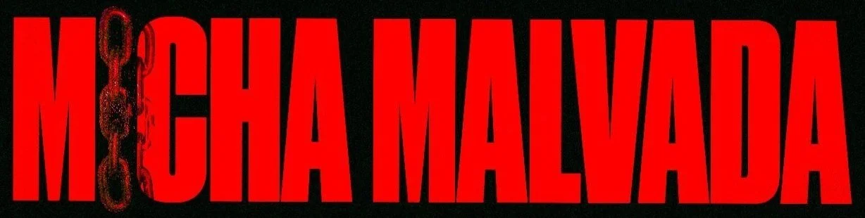 Red text on black background spelling 'MIGRA MALVARDA' next to a chain graphic, suggesting a theme related to incarceration or prison.