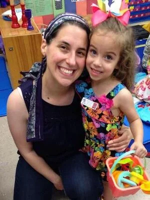 Rebecca and student hug in classroom where Rebecca supports inclusion.jpg