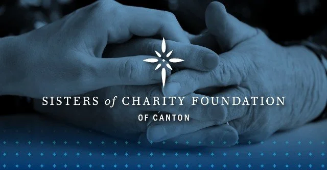 Close-up of two hands clasped together with logo and text overlay for Sisters of Charity Foundation of Canton.