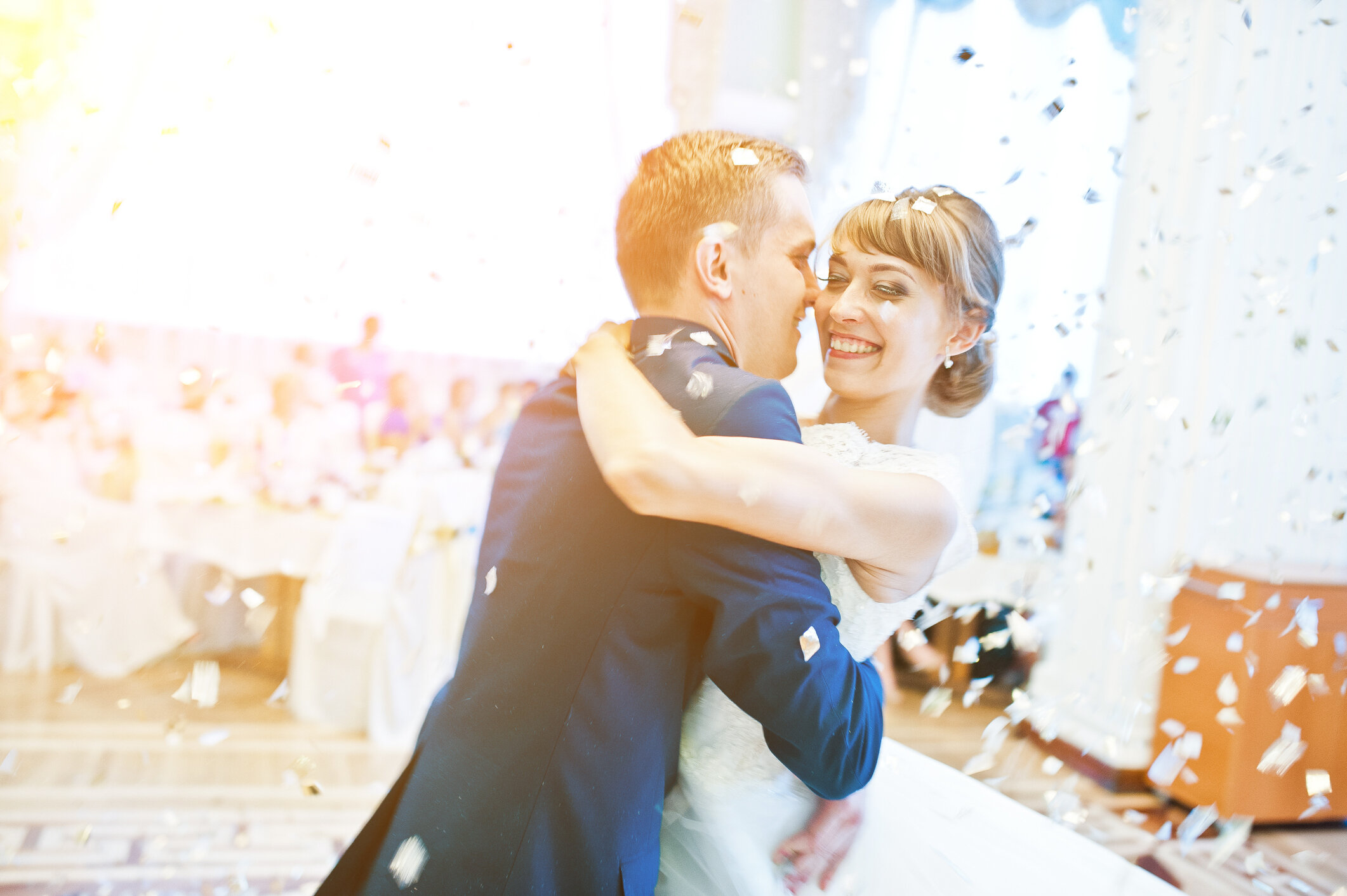 During their Vancouver Wedding DJ experience an overjoyed couple share their first dance while confetti rains down.jpeg