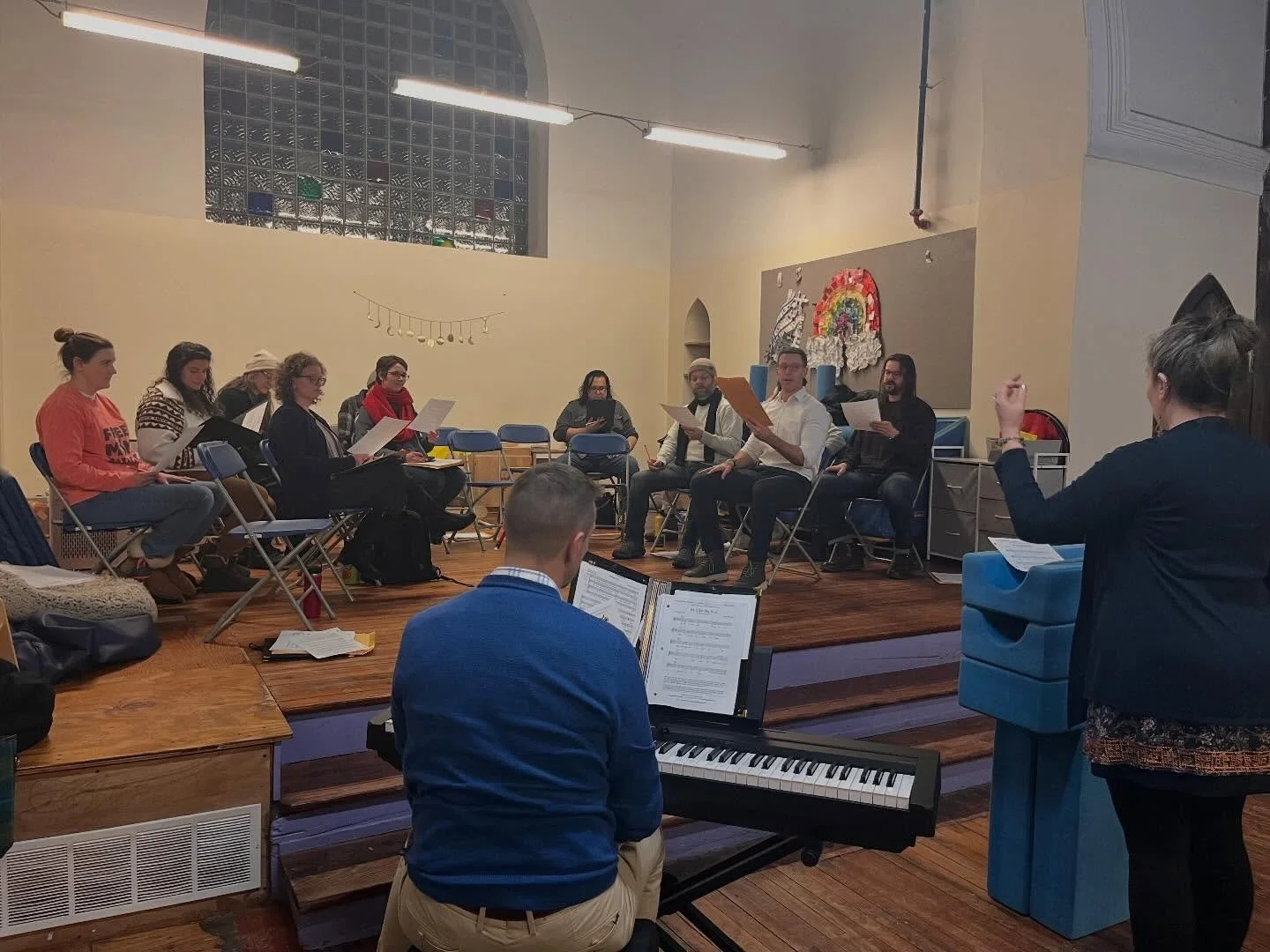 Maybe there&rsquo;s a reason we&rsquo;re channeling our younger selves lately: we&rsquo;ve got a new rehearsal home at Children&rsquo;s Community School! Catch us on the slide at break time. 

[ID: A photo of the choir seated onstage while singing. R