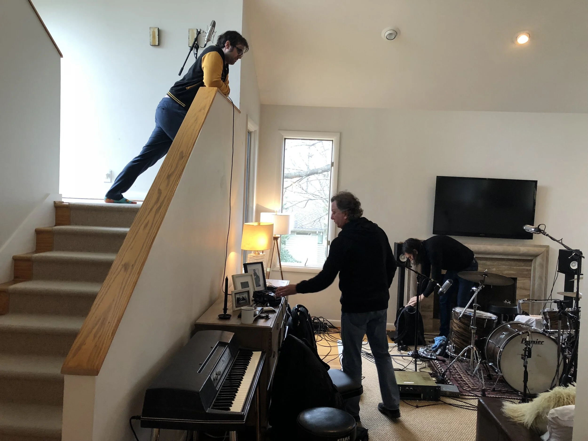 Setting up in the main room for bass guitar and drums to be recorded together. (Engineer Eddie Spear, Bass Guitarist Steve Mackey and Drummer Fred Eltringham).