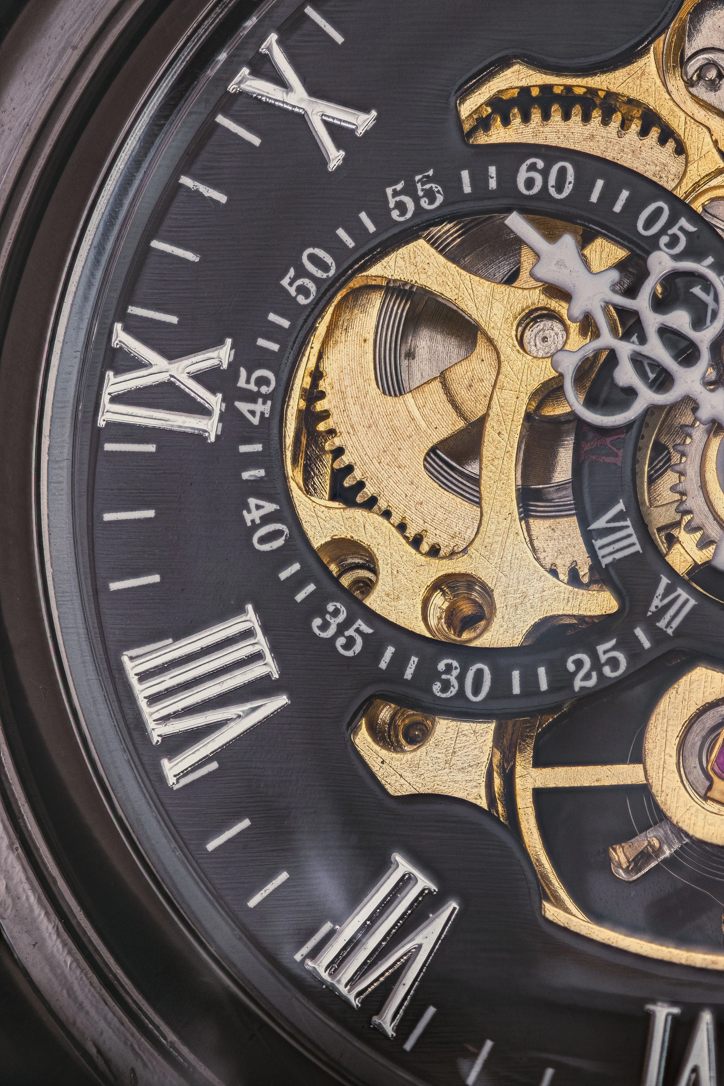 Close-up of a mechanical watch's face, showing intricate gears, Roman numeral hour markers, and detailed internal components.