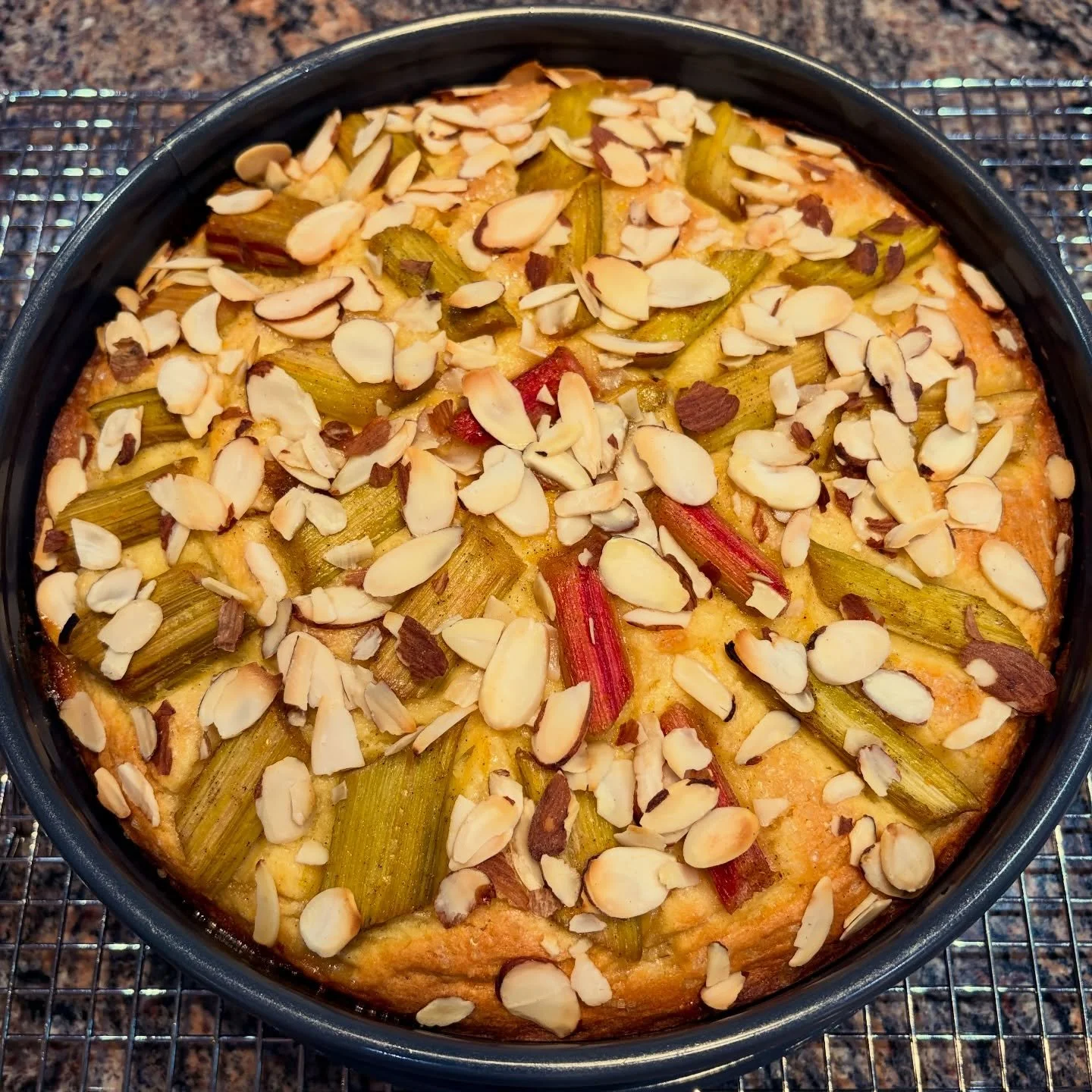Rhubarb tells me that spring has truly arrived.

Every year, I bake this tender, almond‑topped, slightly tangy rhubarb cake. It&rsquo;s a cake that invites you to a lazy afternoon of &ldquo;Kaffee und Kuchen&rdquo; (a German ritual of afternoon coffe