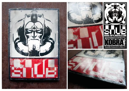 SNUB STEEL STICKER 2011 First prototype of new batch of SNUB steel, currently producing a limited edition run but this artist proof. Stenciled steel plate riveted to wooden panel. 1 of 1 Artists proof 30cm x 21cm x 2cm Signed stamped and numbered. Postage and packing included.