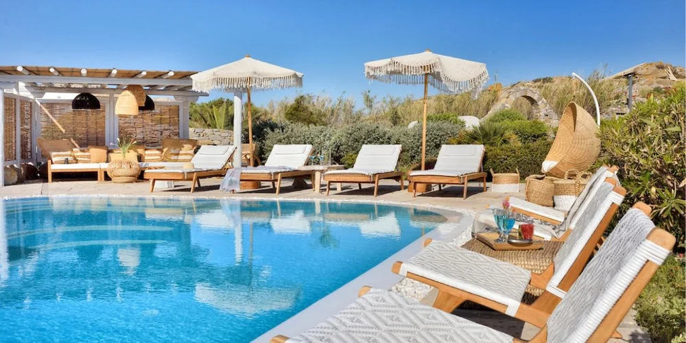 Pool and sun loungers at Villa Clio