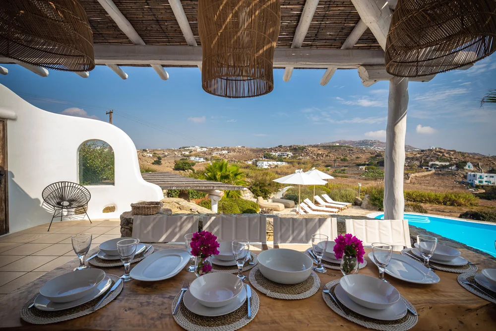 Outdoor table with a view over the island at Villa Lito