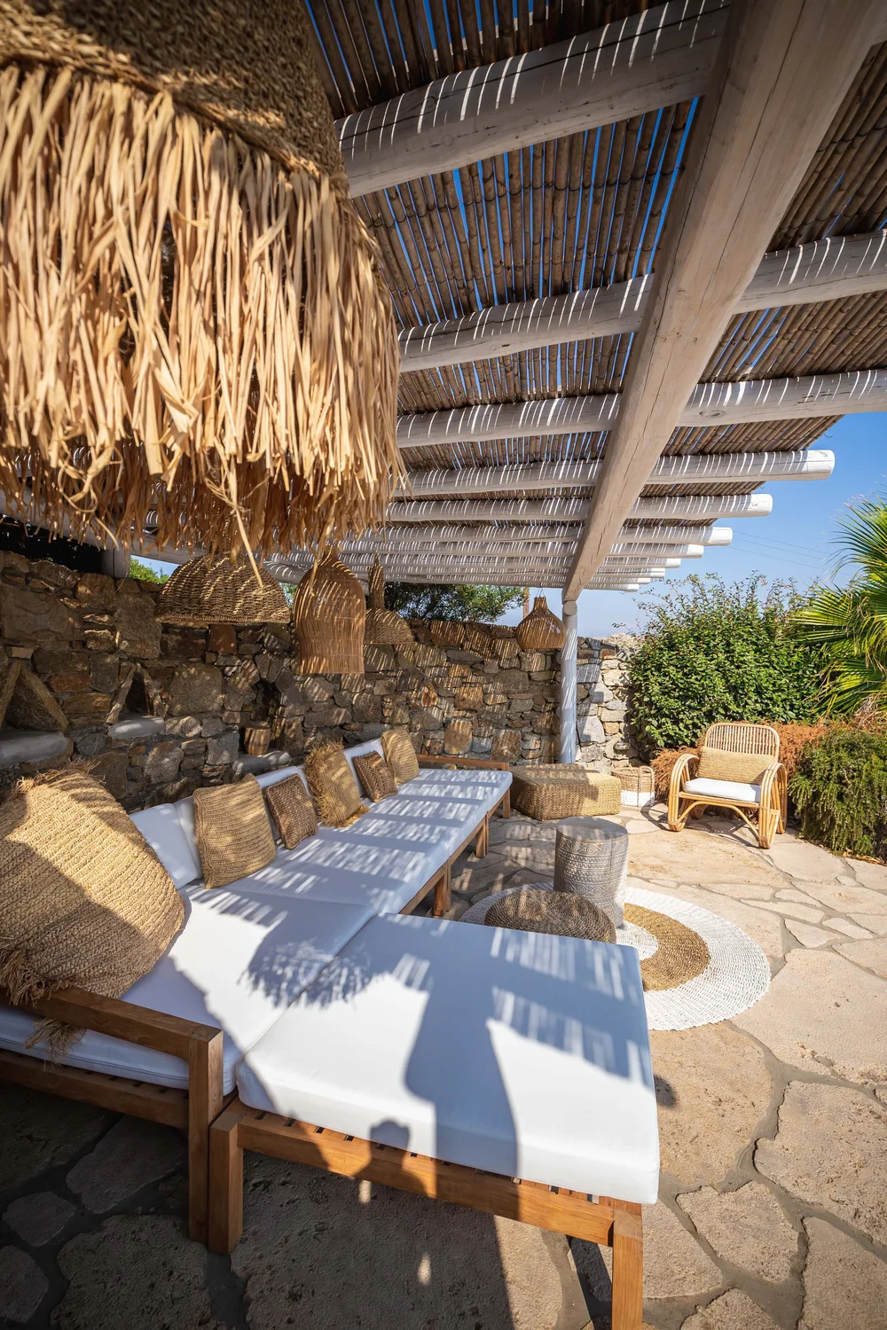 Stone-walled outdoor lounge at Villa Artemis