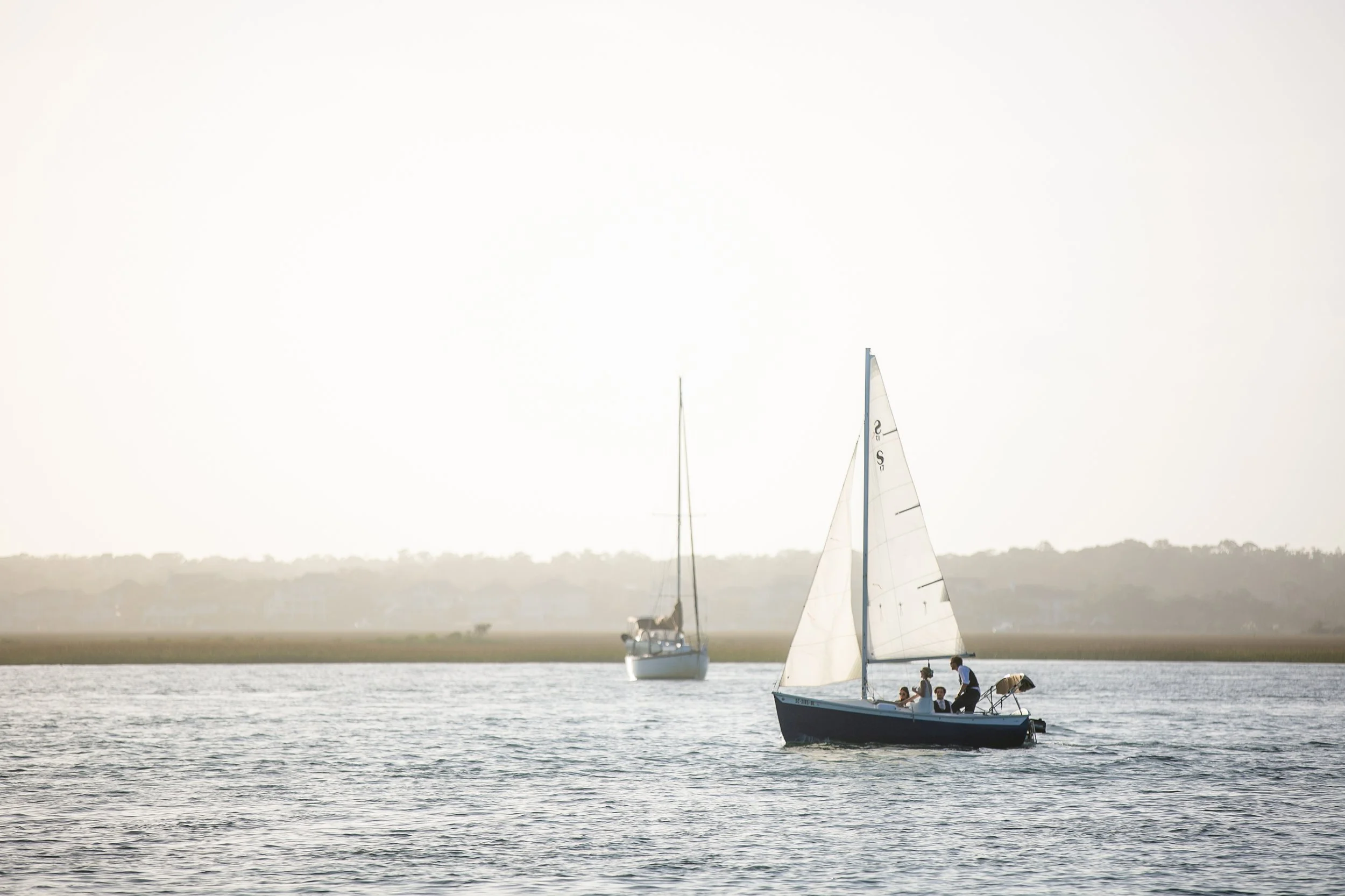 Carolina_Yacht_Club_Wedding_Couple_Sailboat.jpg