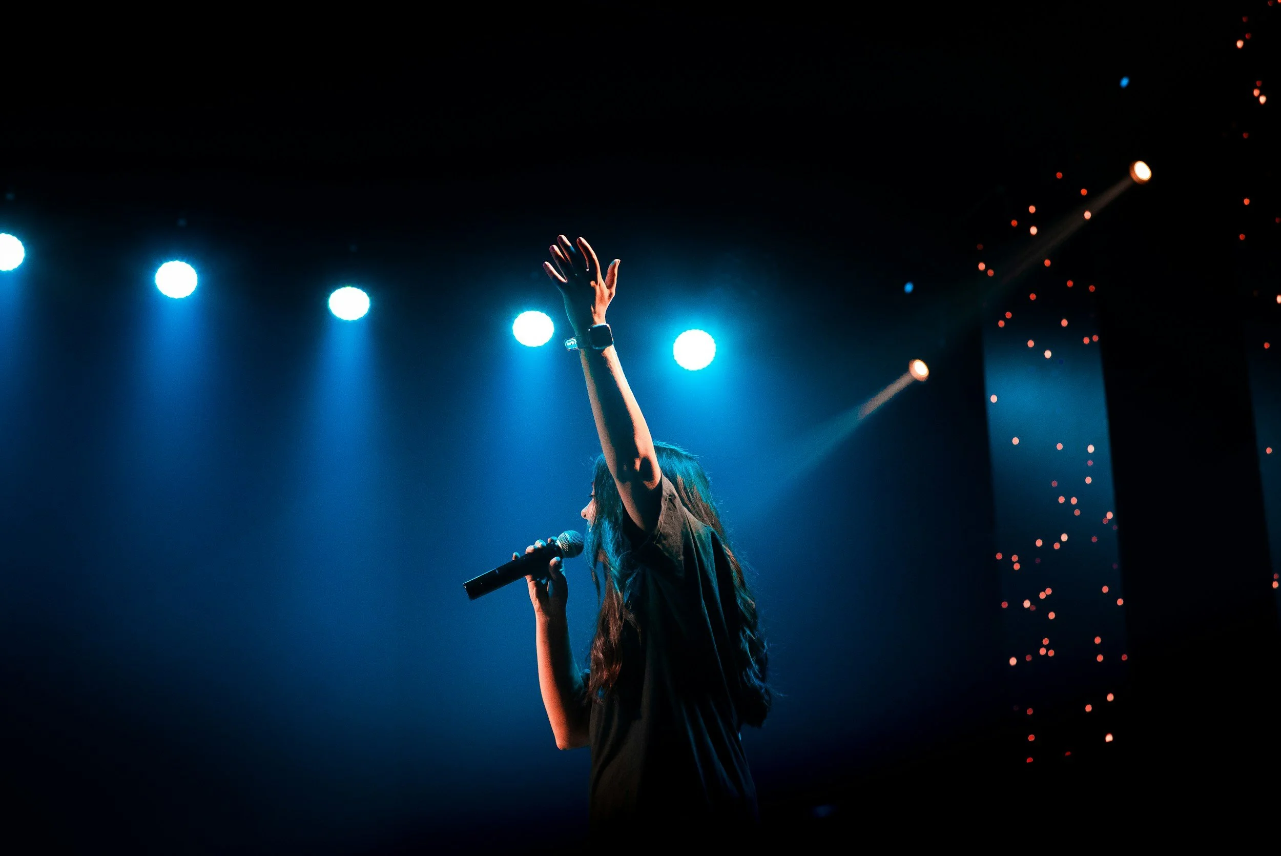 A singer performs on stage