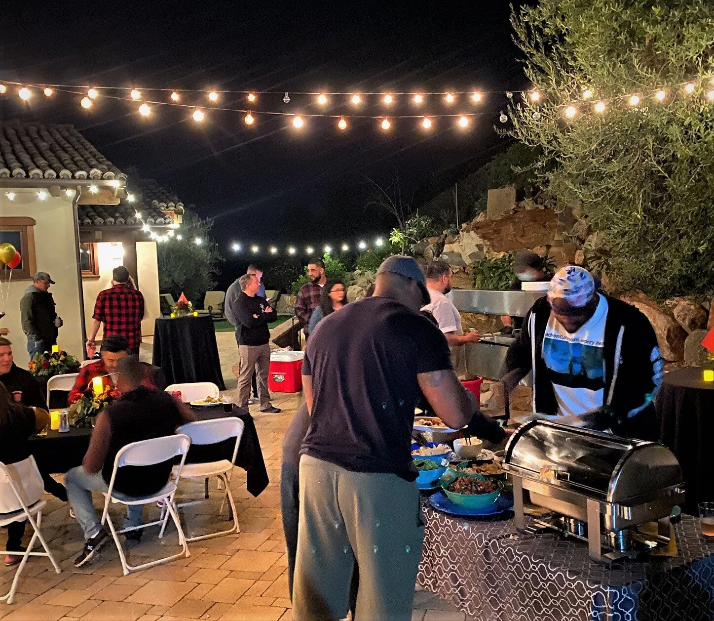 Backyard taco catering for a private night party with a mobile taco bar near me.