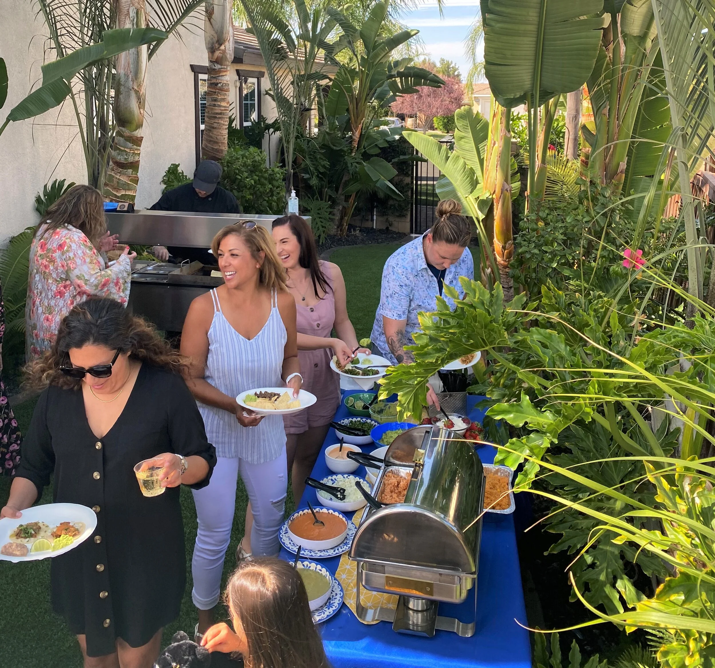 LaLa Tacos providing on-site backyard taco catering for a private party with fresh tacos, buffet service, and guests enjoying the event