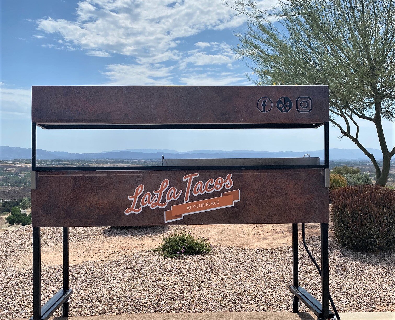 Custom LaLa Tacos taco cart overlooking the Temecula Valley while catering a private party in Temecula Wine Country.
