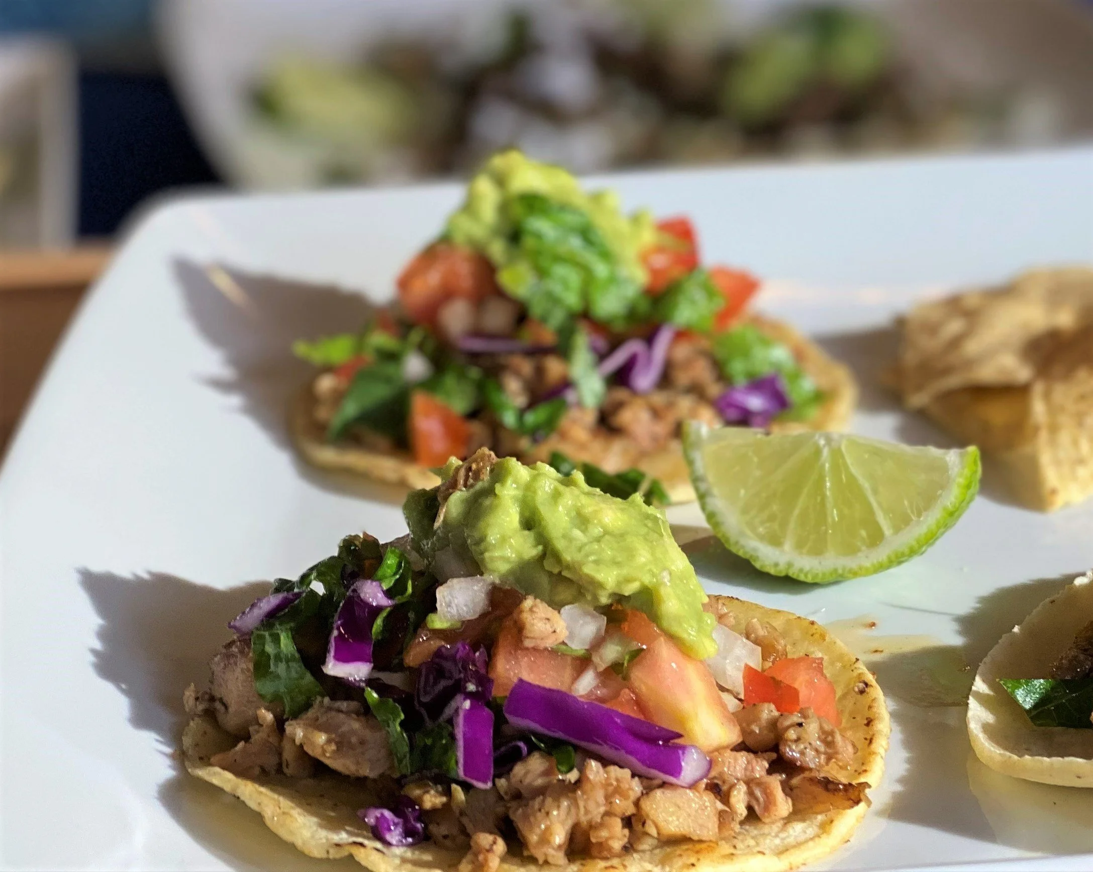 Artisan grilled chicken tacos on fresh corn tortillas, providing a naturally gluten-free and healthy corporate catering option.