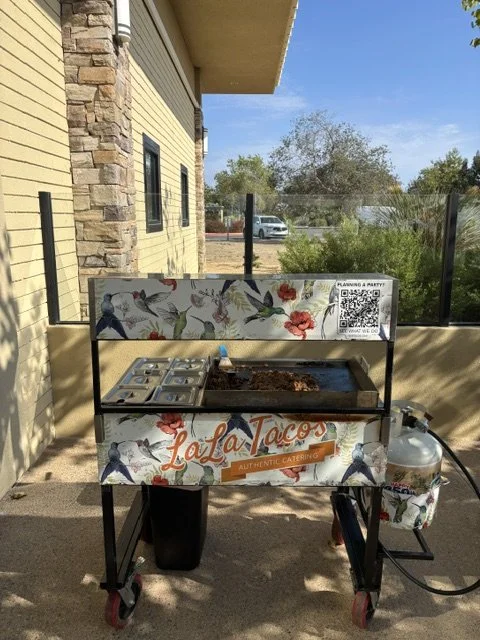 LaLa Tacos custom Hummingbirds & Flowers taco cart serving fresh tacos at a Camp Pendleton retirement party. Vetted and approved Camp Pendleton taco caterer.