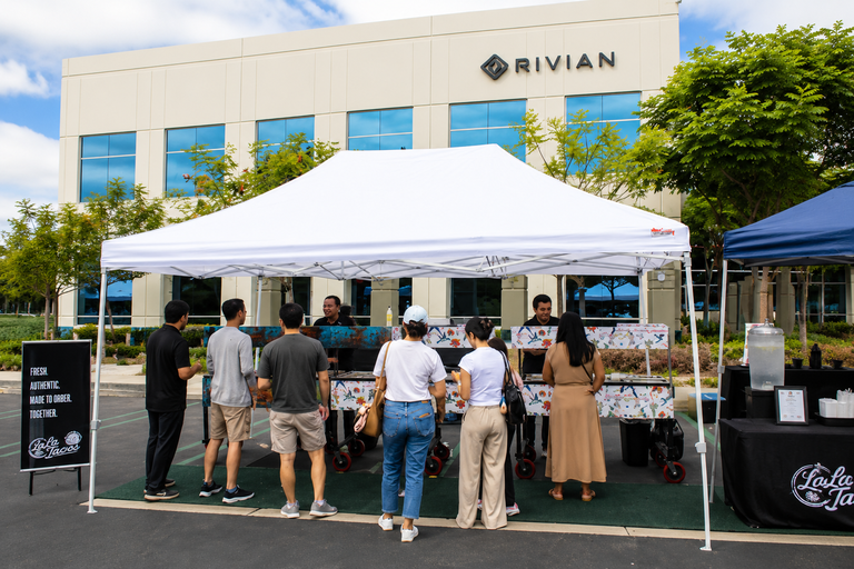 LaLa Tacos staff providing fresh on site corporate catering from custom mobile carts outside the Rivian building in Irvine California