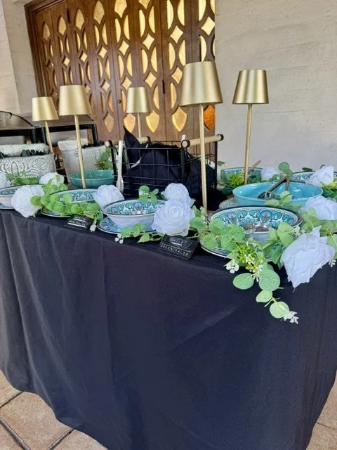 Evening taco bar at The Church of Jesus Christ of Latter-day Saints wedding in Los Angeles featuring decorative table lamps illuminating the fresh toppings for guests.