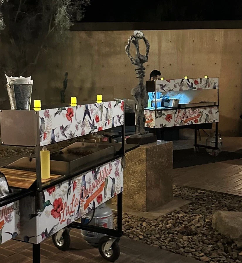 Taco and quesadilla cart catering setup at the Palm Springs Art Museum featuring custom mobile carts and fresh on-site cooking for weddings and special events.