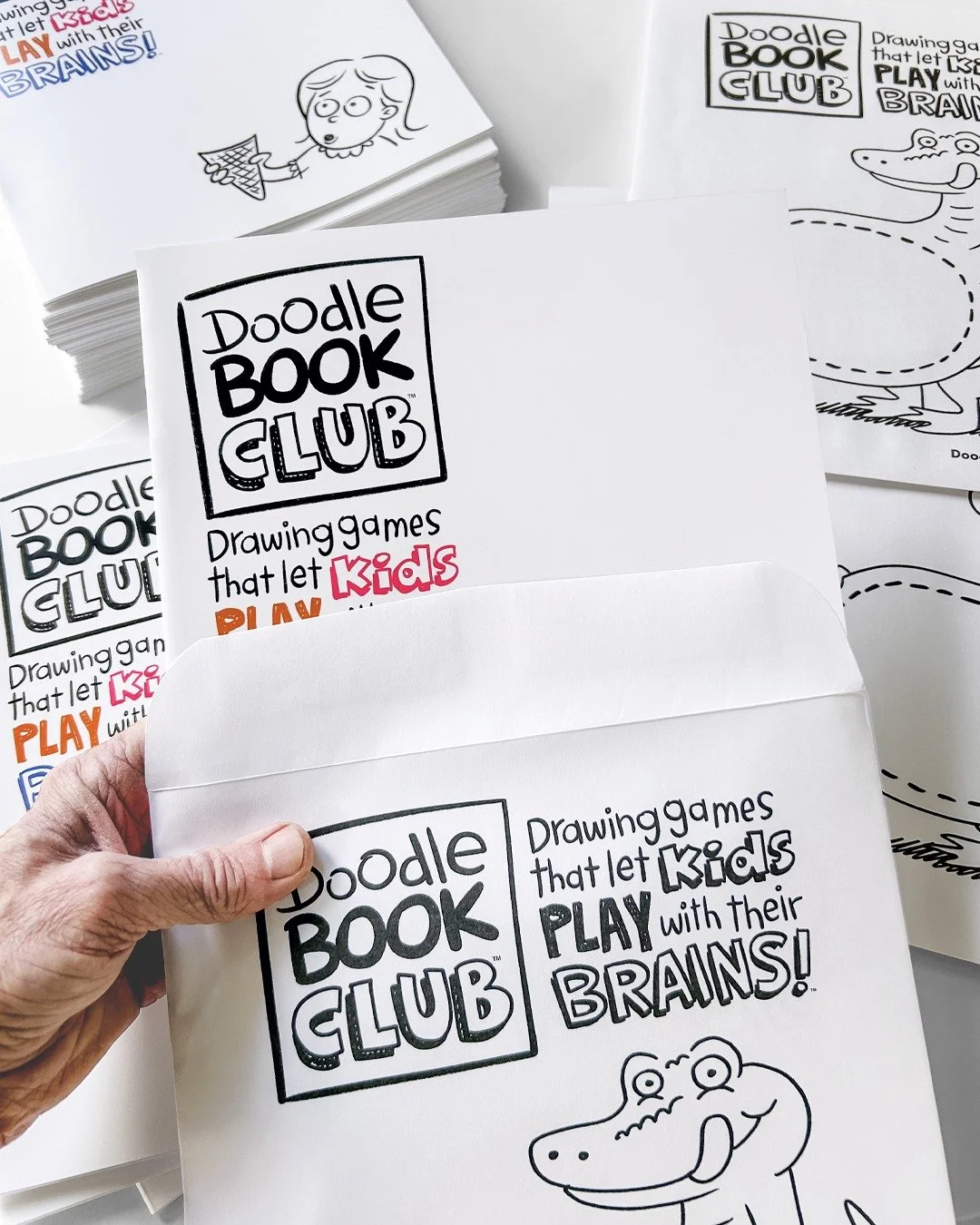It's Packing Day at Doodle Book Club! 

Doodle Book Dave here, and I'm stuffing envelopes with activity books full of fun drawing games that inspire out-of-the-box thinking. This is the very first mailing, and I'm so grateful to all the kids who join