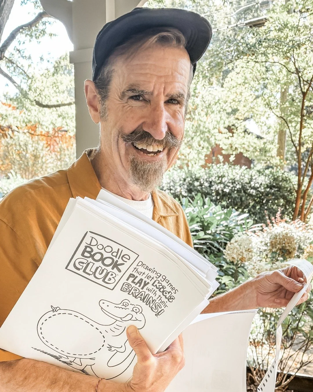 <blush> My wife took some snaps of me packing up Doodle Books and hand-doodling  thank you notes to all the kids in the Club. (She also insisted I share these with you). 

I'm SO excited to mail these out to you all tomorrow! 

Your friend,

Da