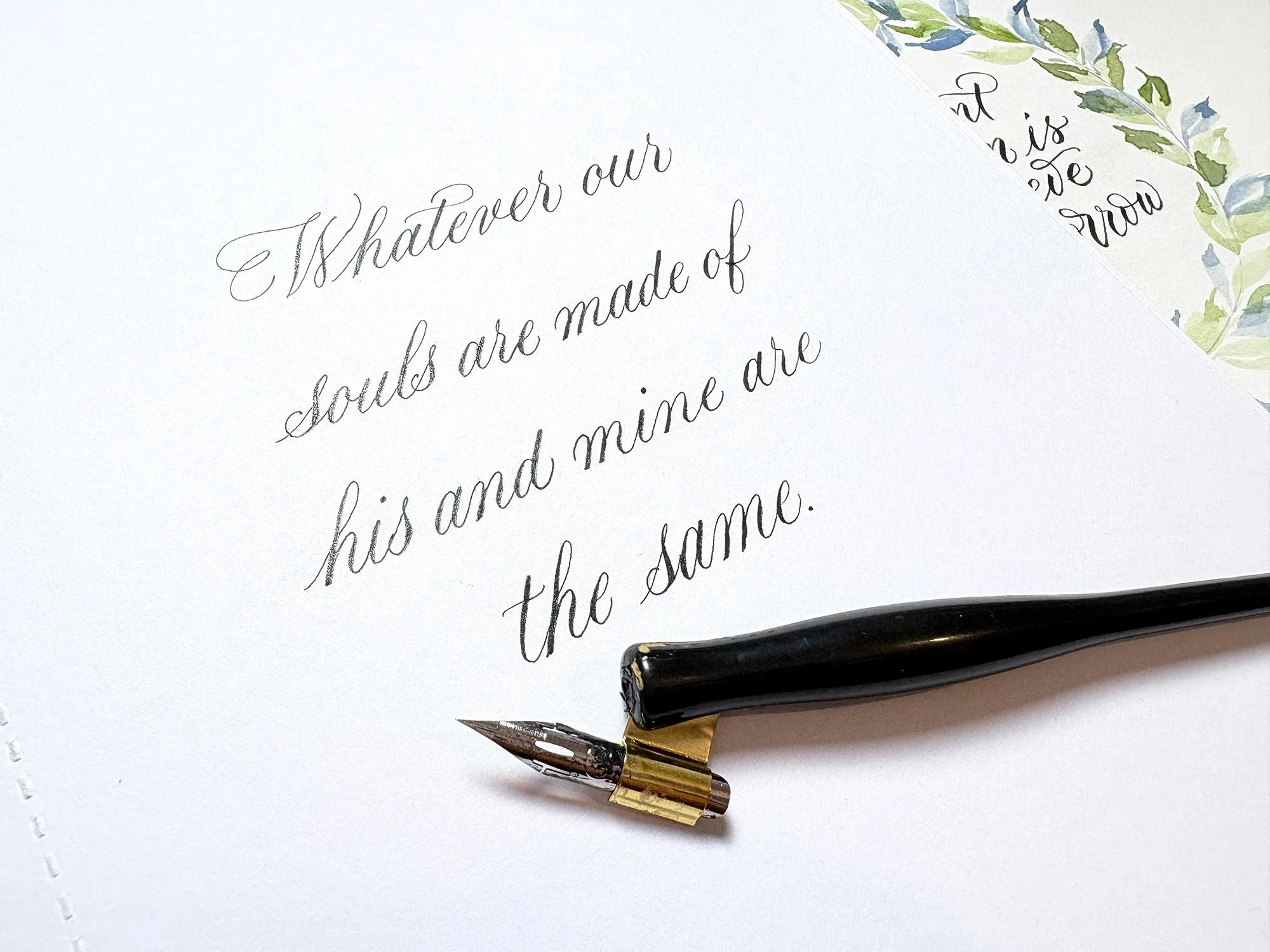 A quote from Wuthering Heights written in copperplate style with a pointed pen.