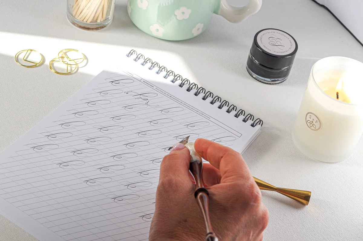 writing-in-calligraphy-workbook-with-a-pointed-pen.jpg