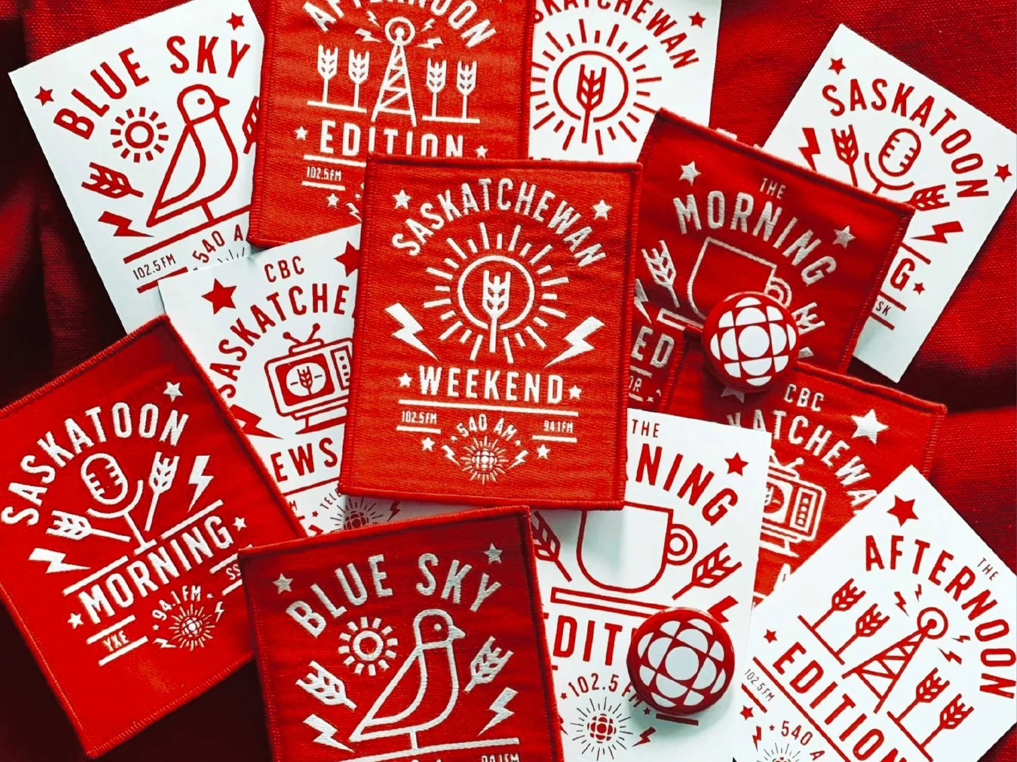 Patches and stickers for visual identity system and badge designs unifying flagship radio and television programs for CBC Saskatchewan by Edmonton graphic designer Nigel Hood