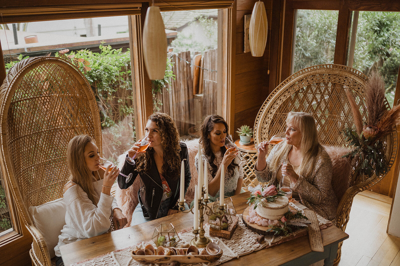 galentine's aprty_toast_champagne_ boho decor_peacock chairs_succulents_event rentals_kiss me in carmel vintage rentals_ boho bachelorette party.jpg