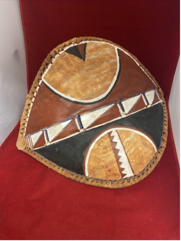 Maasai Warrior Tribal shield and painted cow hide.jpg