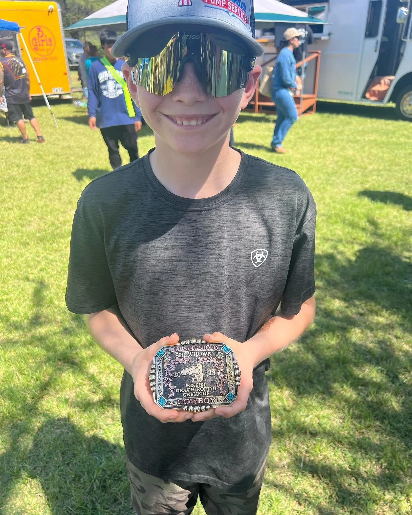 Well our plane was delayed today so we decided to go to the rodeo. This kid wins the reach roping and wins a belt buckle from Kauai. The contestants were kind enough to share a rope. Thank you Kauai Paniolo showdown for showing us hospitality and som