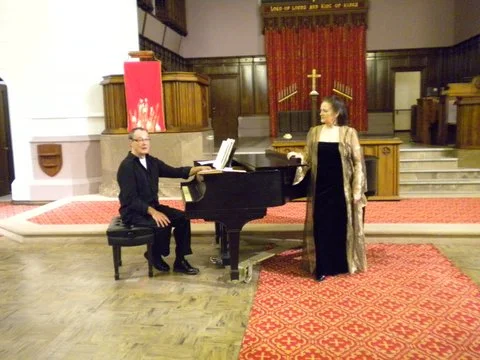 April Evans performing with Tom