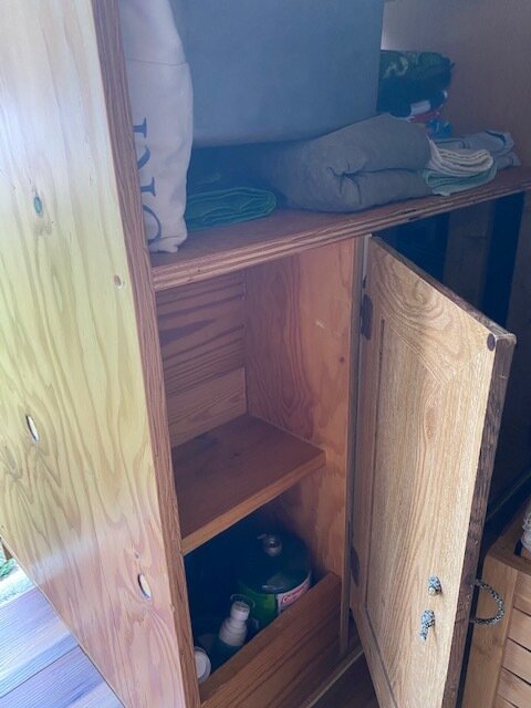  Reinforced these shelves and slid our reusable grocery bags into this little space under the sink. 