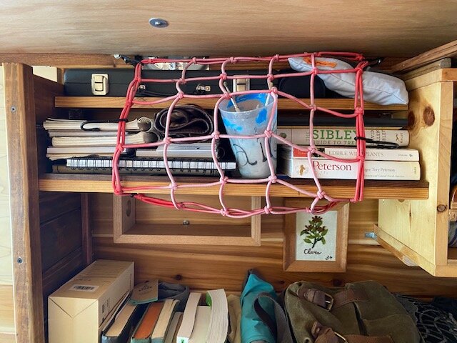  A sophisticated restraint system for our art supplies. (Between us, we have 9 notebooks. It’s a problem.) 