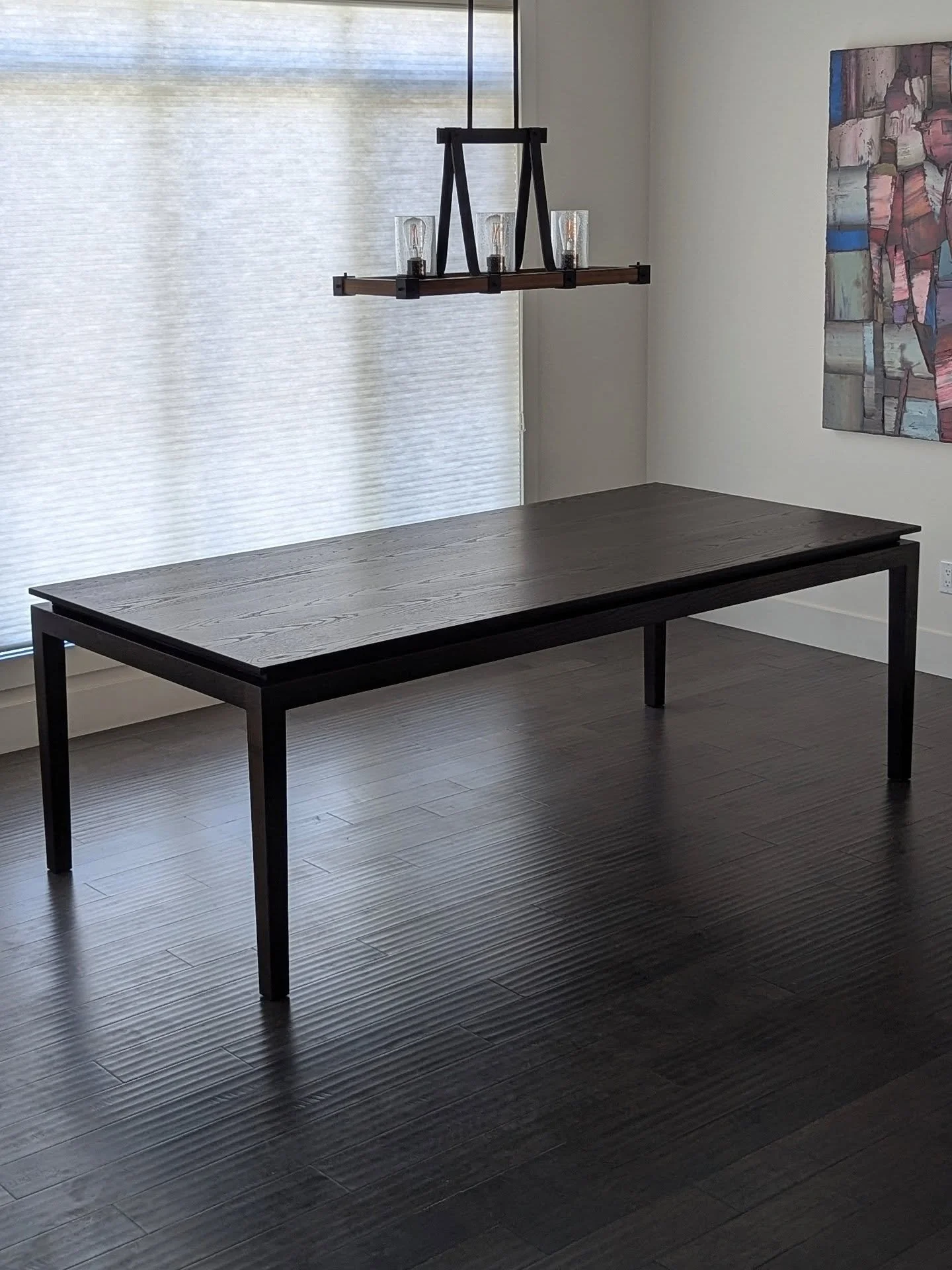 Crafted from solid Ash with a custom espresso stain, this modern dining table was actually inspired by a design my client spotted in a French interior design magazine and we brought it to life! 

#calgaryInteriordesign #yycliving #customdiningtable