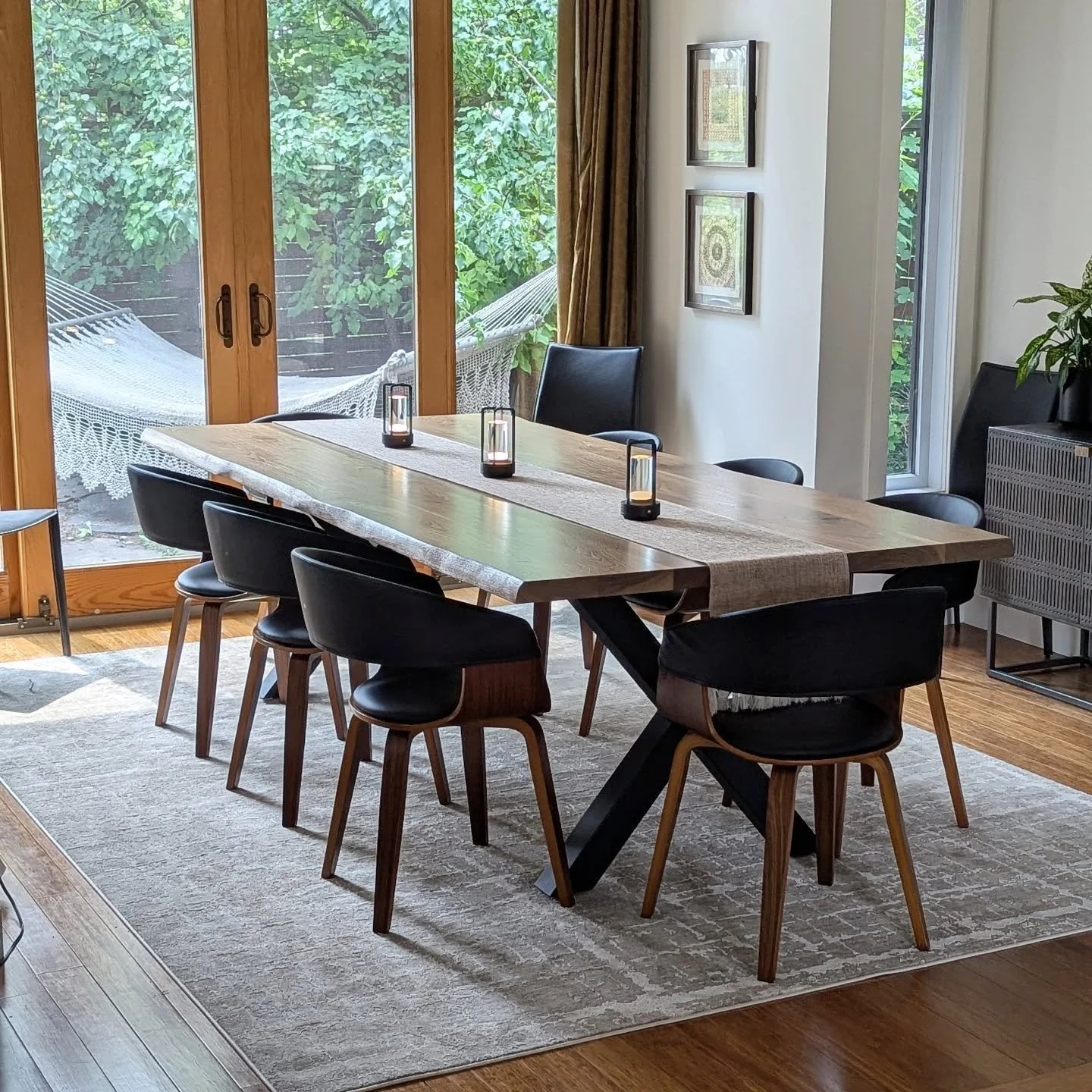 Featuring our Canadian black walnut carved live edge dining table.

This design allows our clients to have the live edge look that they are desiring, but also allows us to create a more uniform and consistent width for those custom sizes and spaces!