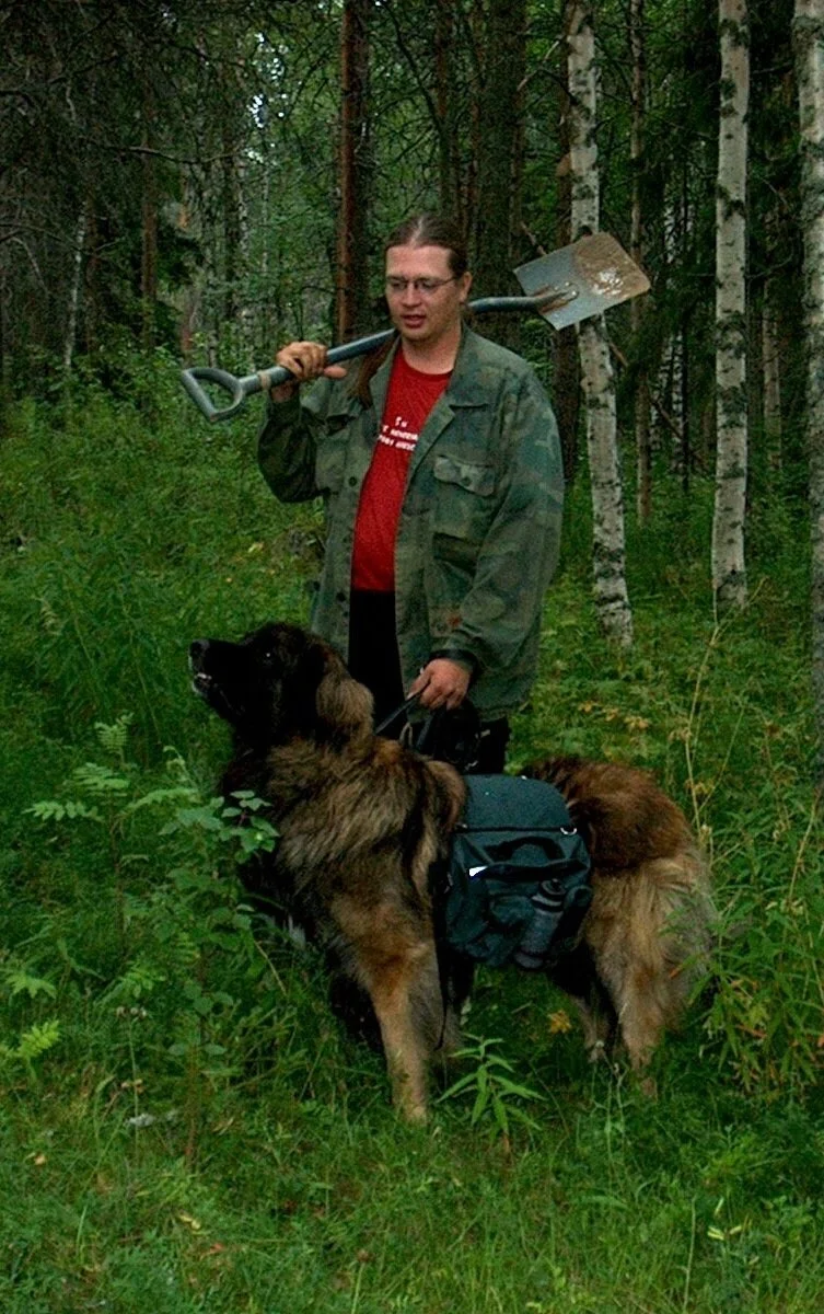 Early exploration in Finland, investigating soil samples. The geologist dug the samples and carried the till samples and Reino the dog carried geochemical samples and drinking water.